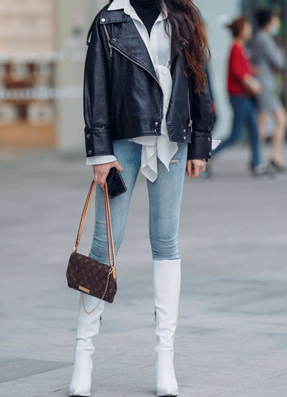 White boots with light washed jeans